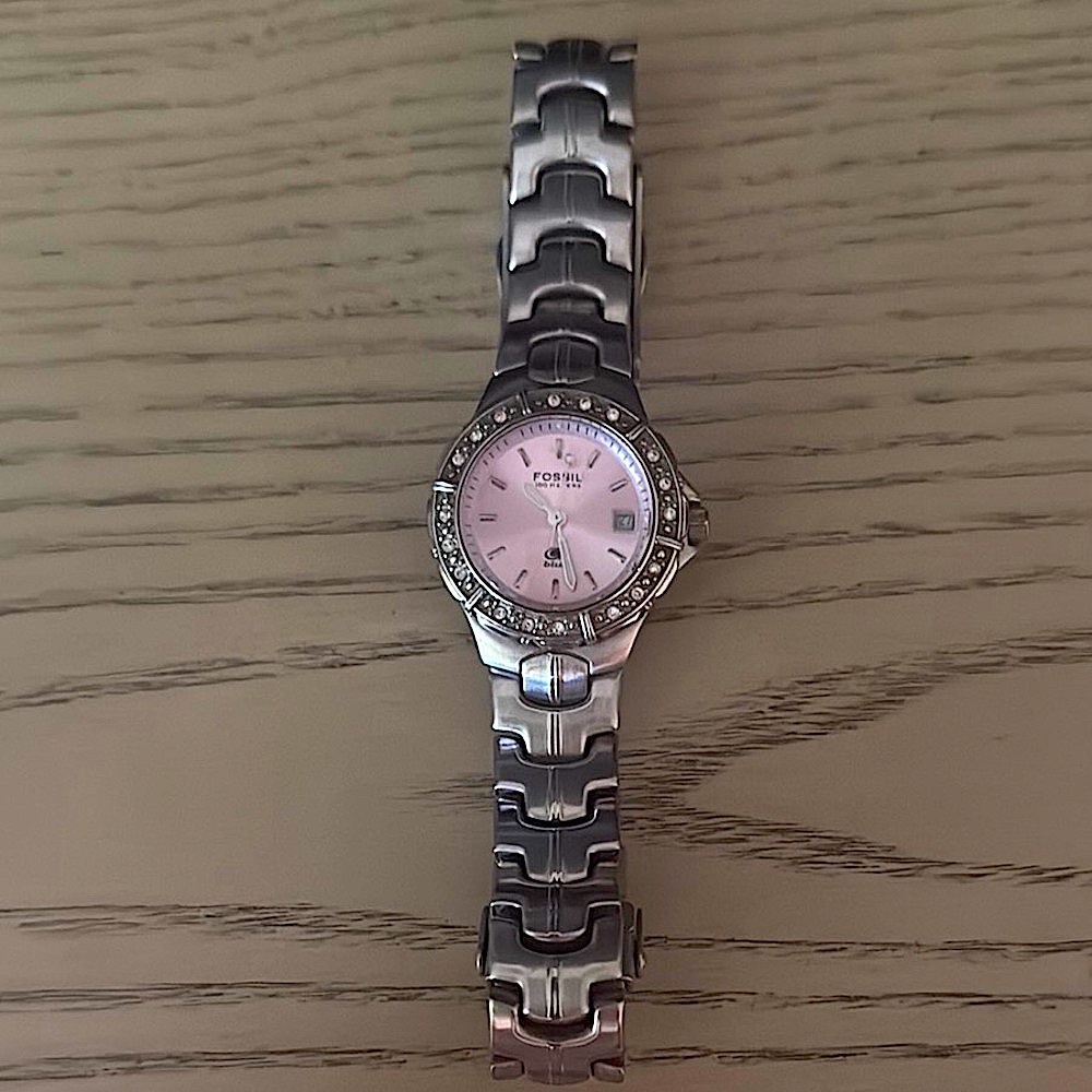 Fossil Silver and Pink Classic Watch with stones all around face.